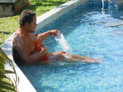 Naked man in pool